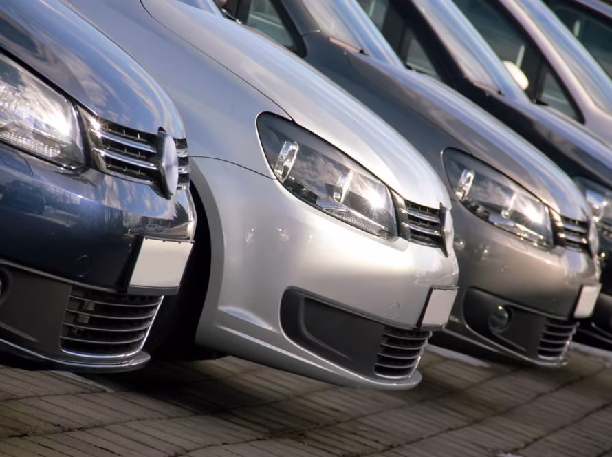 Several Volkswagen cars lined up next to each other.